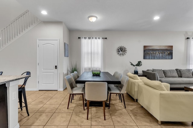 dining space featuring light tile patterned floors