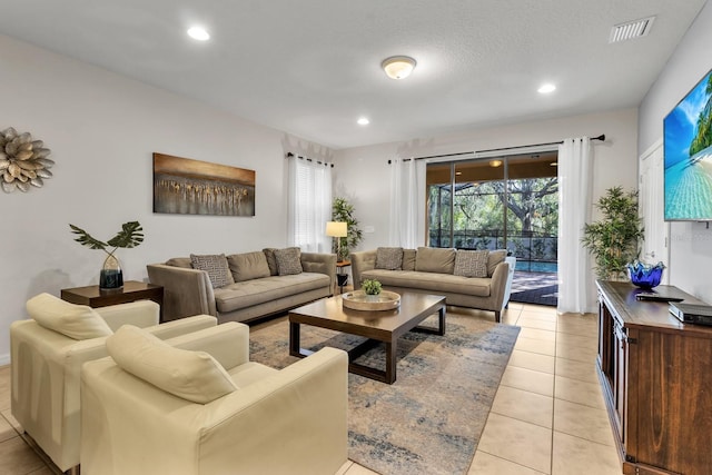 tiled living room with a textured ceiling