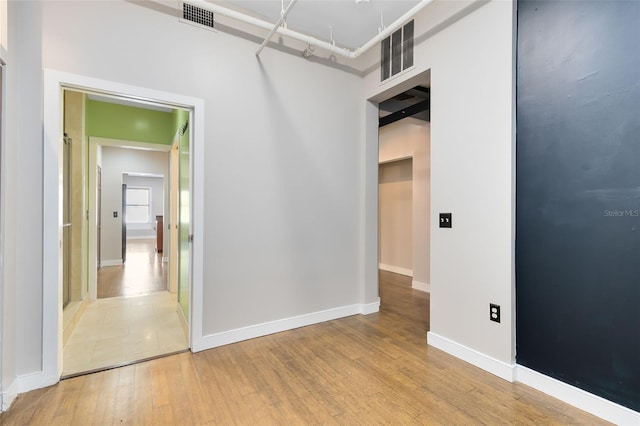 empty room with wood-type flooring