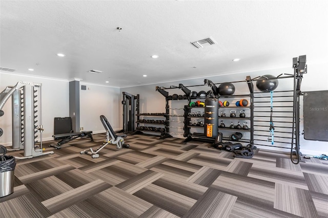 gym with a textured ceiling and ornamental molding