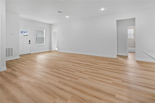 unfurnished living room with light hardwood / wood-style flooring