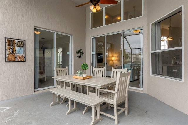 view of patio featuring ceiling fan