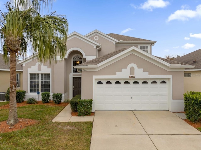 view of front facade featuring a garage and a front yard