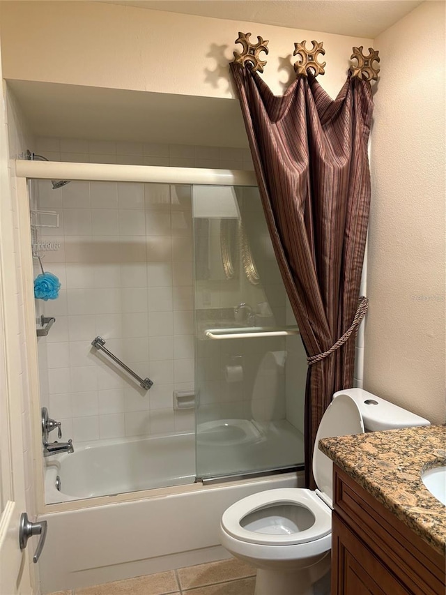 full bathroom with toilet, tile patterned floors, shower / bath combination with glass door, and vanity