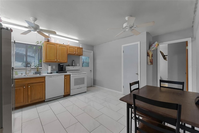 kitchen with ceiling fan, white appliances, and sink