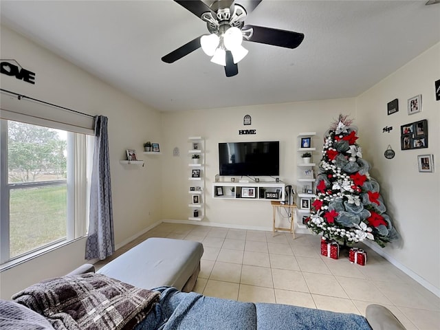 tiled living room with ceiling fan