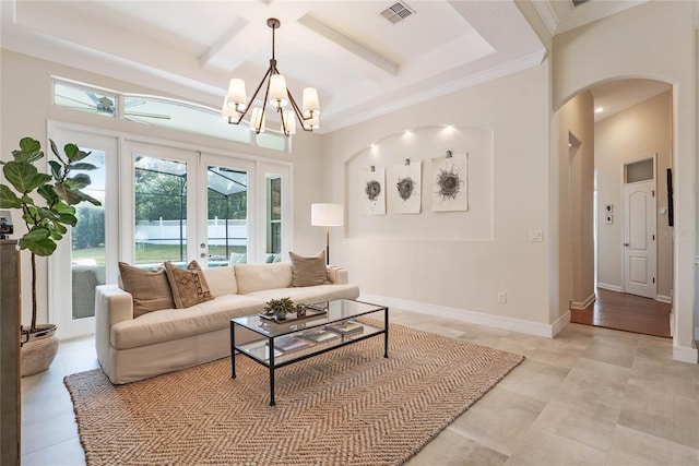 living room with beamed ceiling, coffered ceiling, ornamental molding, french doors, and a chandelier