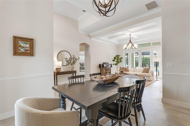 dining space with an inviting chandelier, coffered ceiling, french doors, ornamental molding, and beam ceiling