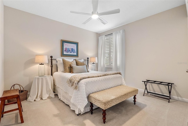 bedroom featuring ceiling fan and light carpet