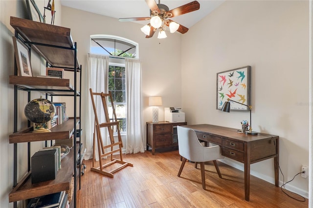 office space featuring ceiling fan and light hardwood / wood-style flooring