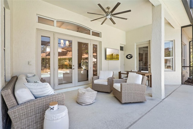 view of patio / terrace with ceiling fan, an outdoor living space, and french doors