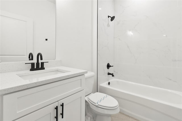 full bathroom featuring vanity, tiled shower / bath combo, and toilet