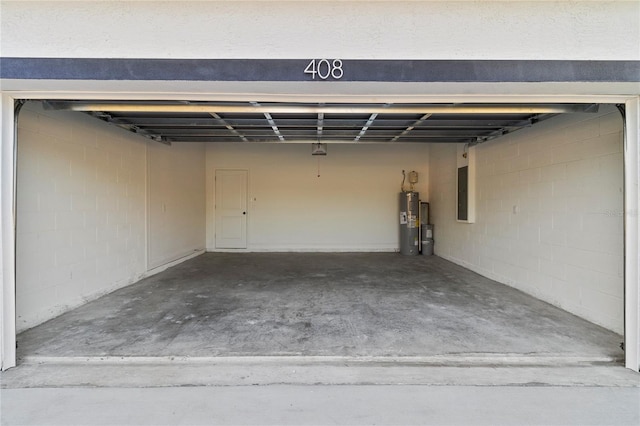 garage with electric panel and water heater