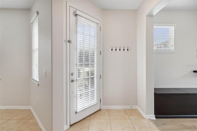 entryway with light tile patterned floors