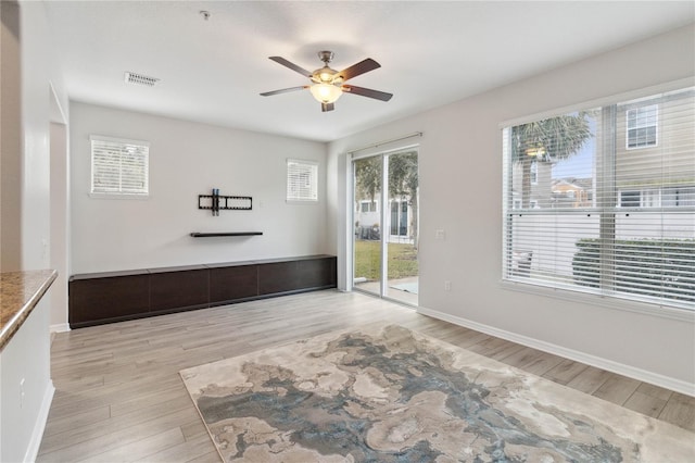 interior space featuring ceiling fan and light wood-type flooring