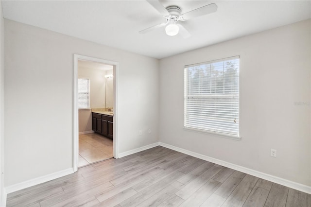 unfurnished room with ceiling fan and light hardwood / wood-style flooring