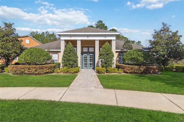 view of front facade featuring french doors and a front yard