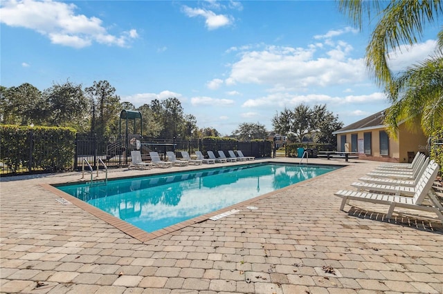 view of pool featuring a patio