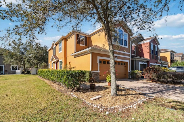 view of home's exterior with a garage and a yard