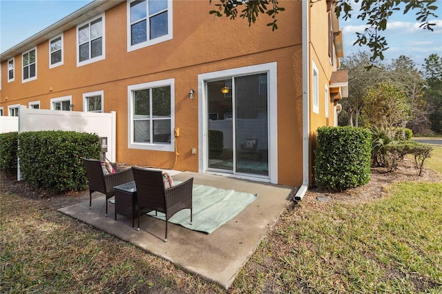 rear view of house with a patio