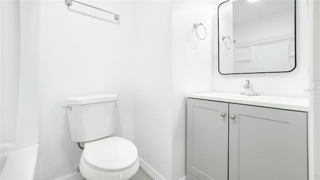 bathroom with toilet and vanity