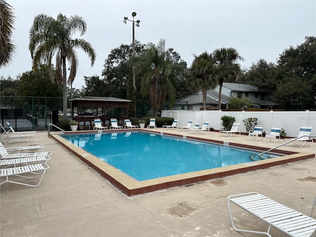 view of pool with a patio area and a gazebo