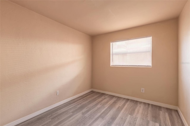 spare room with light wood-type flooring