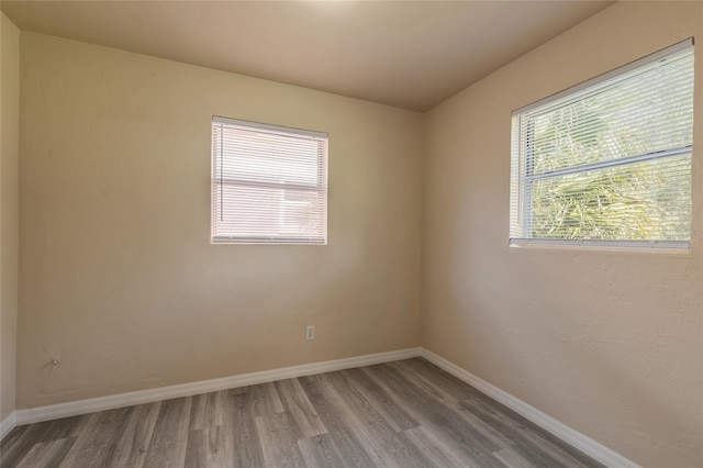 spare room featuring hardwood / wood-style floors