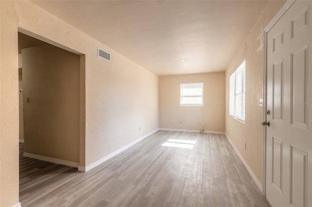 empty room featuring wood-type flooring