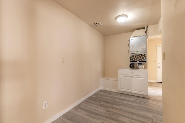 hall with light hardwood / wood-style flooring