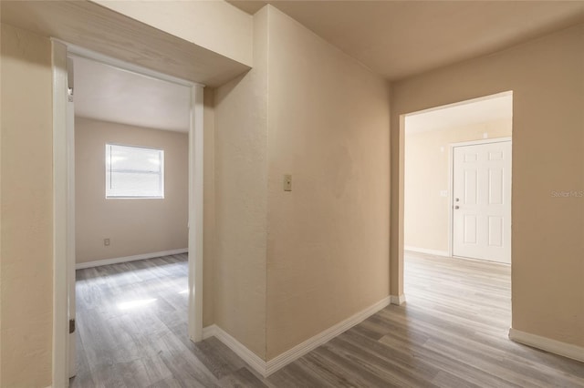 corridor featuring hardwood / wood-style floors