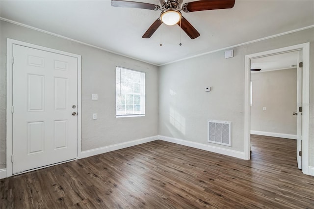 foyer with ceiling fan, dark hardwood / wood-style flooring, and crown molding