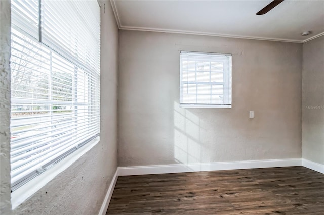 unfurnished room with dark wood-type flooring, ornamental molding, and ceiling fan