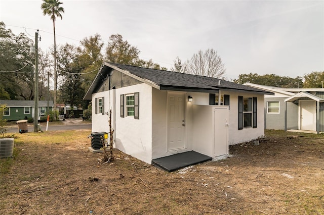 back of property featuring central air condition unit