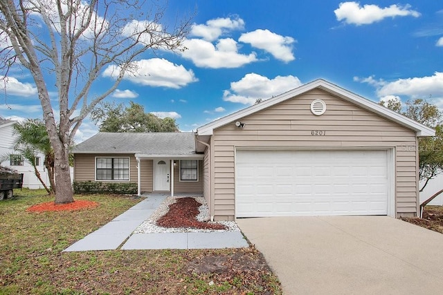 ranch-style house featuring a garage