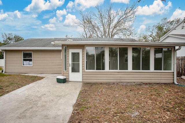 rear view of house featuring a patio