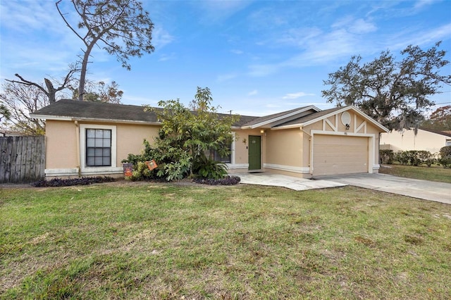 ranch-style house featuring a front yard and a garage