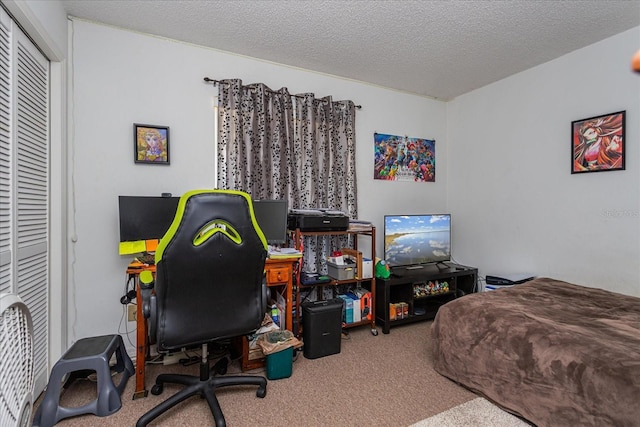 carpeted bedroom featuring a textured ceiling and a closet