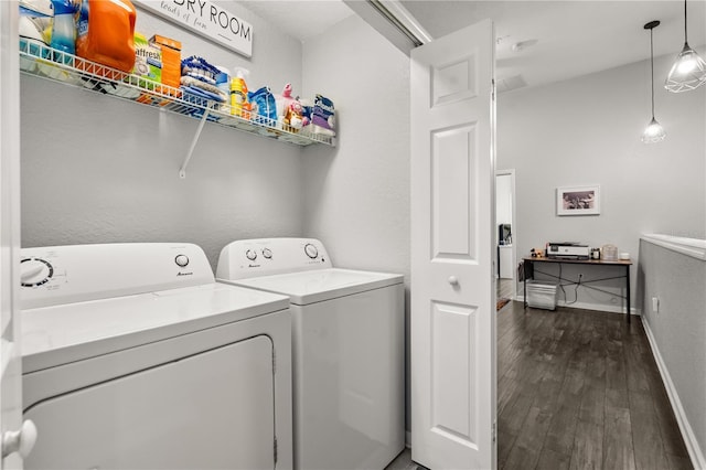 washroom with washer and clothes dryer and dark hardwood / wood-style floors