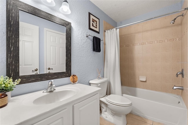 full bathroom featuring toilet, vanity, tile patterned floors, shower / bathtub combination with curtain, and a textured ceiling