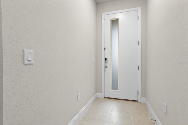 doorway to outside featuring light tile patterned floors