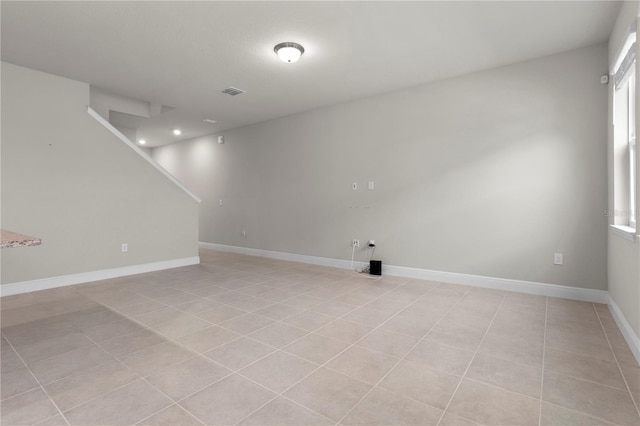 basement featuring light tile patterned floors