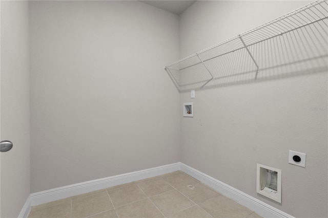 washroom featuring hookup for a washing machine, electric dryer hookup, and tile patterned floors