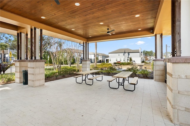 exterior space featuring ceiling fan