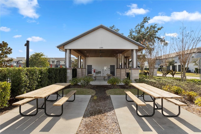 exterior space featuring ceiling fan