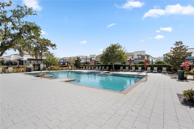 view of swimming pool featuring a patio area