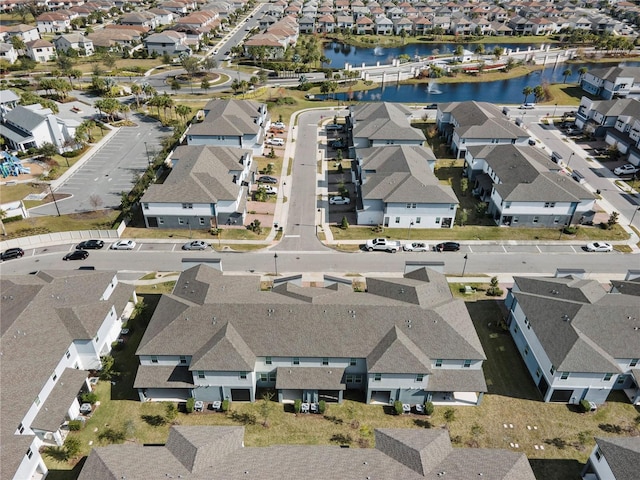 drone / aerial view with a water view