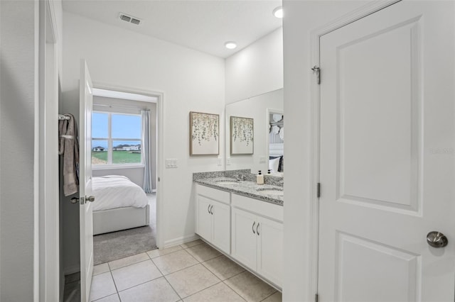 bathroom with vanity and tile patterned flooring