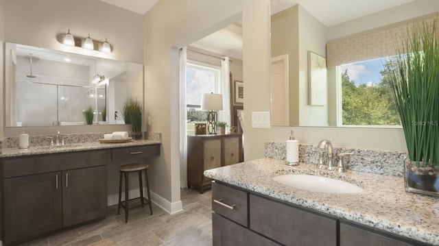 bathroom featuring an enclosed shower and vanity