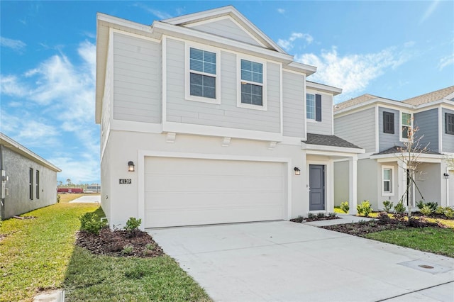 view of front property with a garage and a front yard